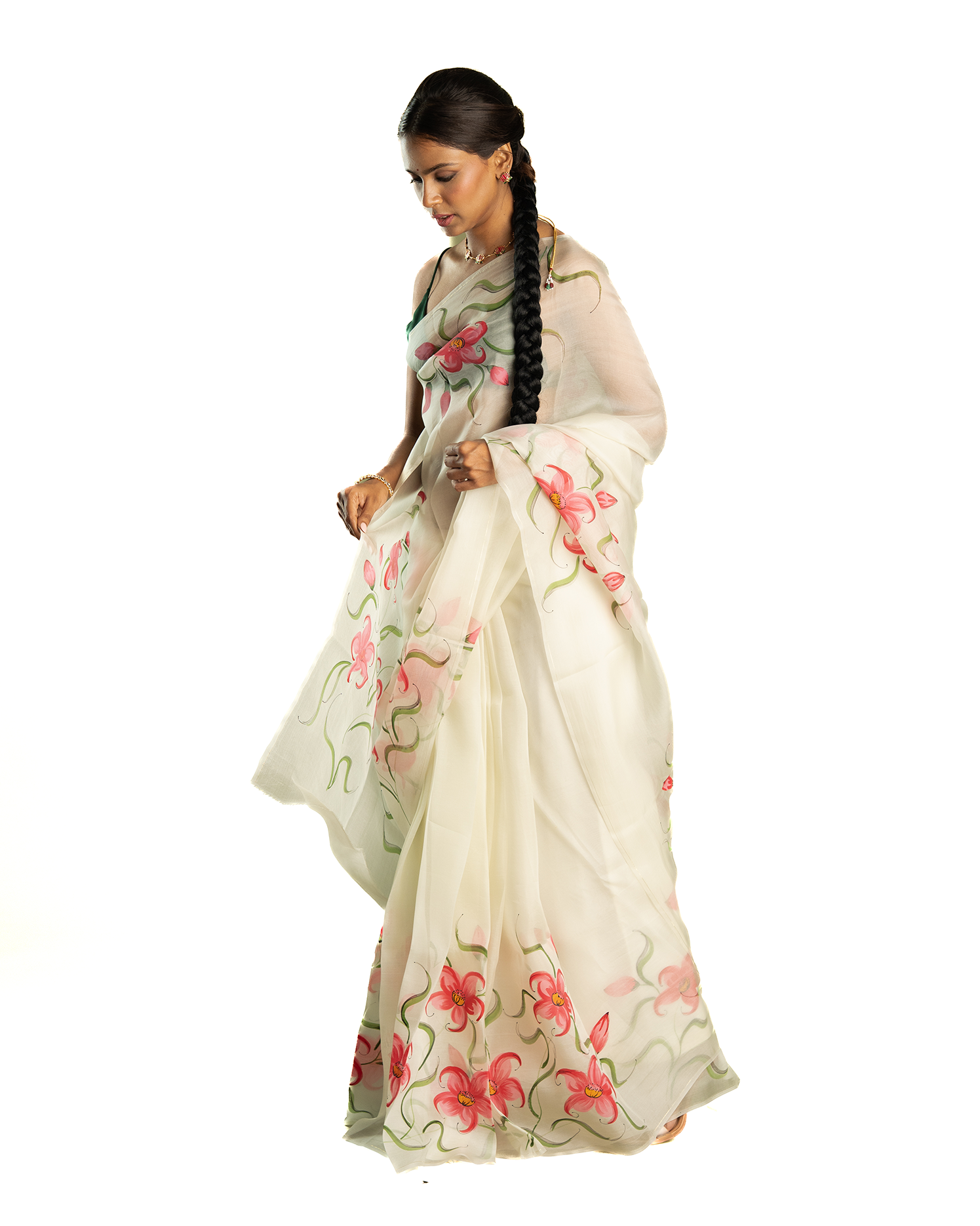 Woman wearing a pink floral saree on a white background