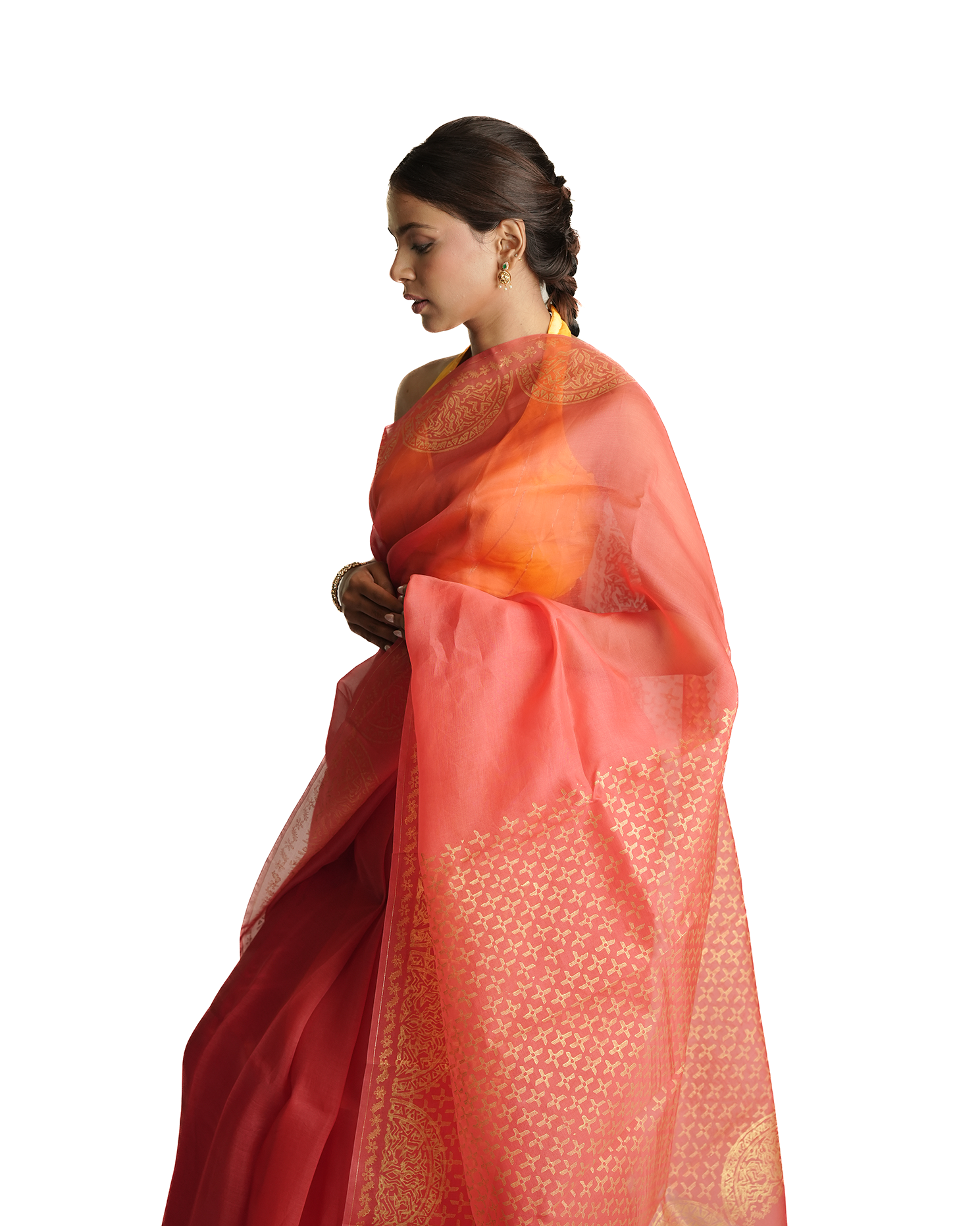 Woman wearing a pink saree with a white background